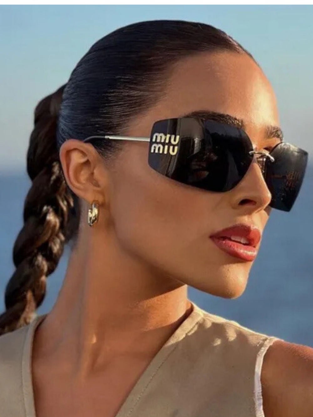 Miu Miu rectangle wrap sunglasses. Dark gray with gold logo. Authentic.